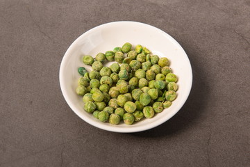 Fried green beans on a white plate