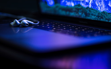 colorful close-up of handsfree on a laptop keyboard with super shallow depth of field