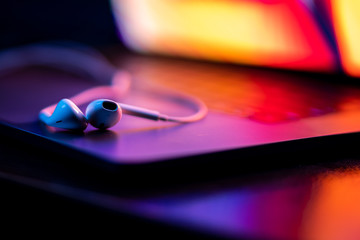 colorful close-up of handsfree on a laptop keyboard with super shallow depth of field