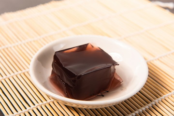 The homemade pudding is on a white plate