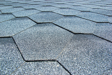 Obraz premium Gray soft roof on the roof of the house. Close-up.