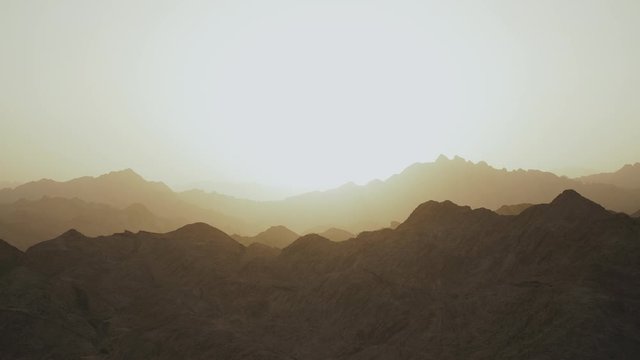 Amazing sunset at Egypt Sinai mountains, Sinai desert, mountains peaks, silhouette of mountains, flat, slow motion, 4k