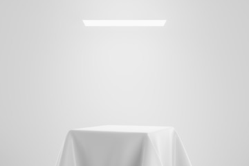 White fabric on pedestal or podium display with satin textile platform concept on studio...
