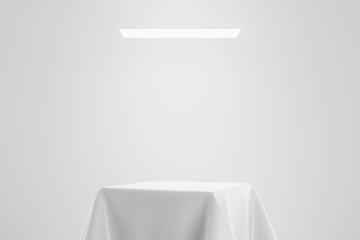 White fabric on pedestal or podium display with satin textile platform concept on studio...