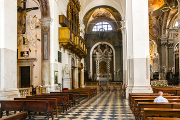 Fototapeta na wymiar Udine, Italy. Interiors of catholic church (Cathedral of Santa Maria Annunziata) in Udine.