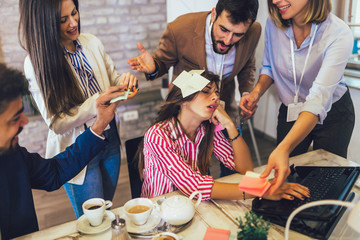Beautiful businesswoman at workplace, ignoring work, not listening to annoying clients or bothering colleagues talking to her.