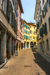 Fototapeta na wymiar Udine, Italy. Beautiful streets of Udine in sunny day.