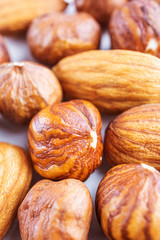 Peeled almonds and hazelnuts close-up. Macro photo of nuts. The concept of healthy food, vegetarianism.