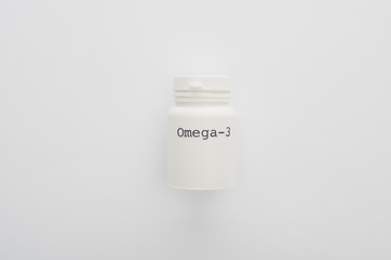 Top view of container with omega-3 lettering on white background