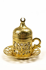 Fototapeta na wymiar gold Turkish coffee Cup isolated on white background