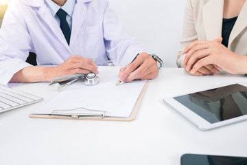 Doctor consulting patient hands closeup. medical service, consultation or education