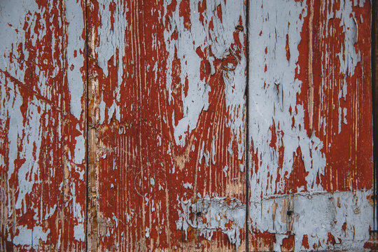 Old wooden wall with remnants of paint. Background done in retro style