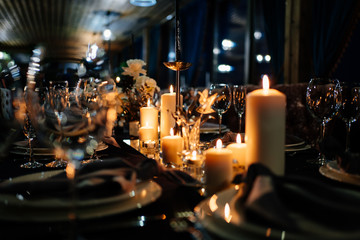 festive table setting candles for wedding party