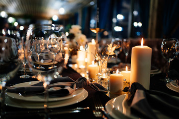 Fototapeta na wymiar festive table setting candles for wedding party