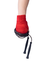 hand bandaged with red bandages for martial arts holds black jumpers, isolated on white