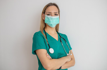 Female nurse standing arms crossed. Confident young woman doctor. Female nurse young pretty woman...