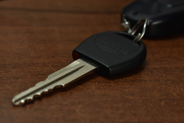car key on a wooden table
