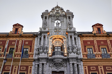 Historic buildings and monuments of Seville, Spain. Architectural details, stone facade.