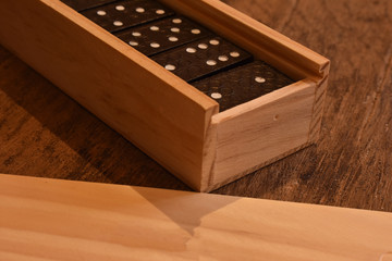 dominoes in a wooden box