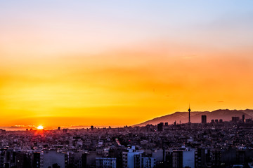Beautiful sunset over Tehran skyline with Milad tower in the Frame and amazing colorful sky.
