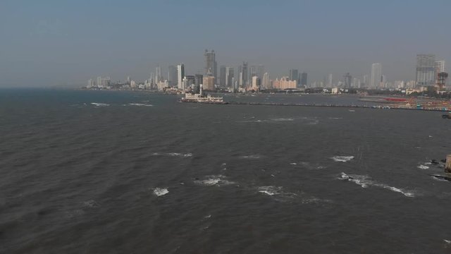 Rising drone shot over Haji Ali and Mumbai's coastline