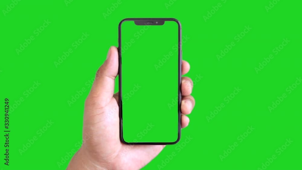 Wall mural man's hand holding a black smartphone with green screen and touching or press display, man using mob