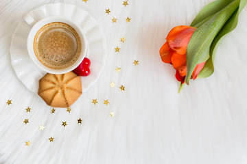 Obraz na płótnie Canvas Romantic holiday concept: Aromatic black coffee with cookie on white background. Copy space.