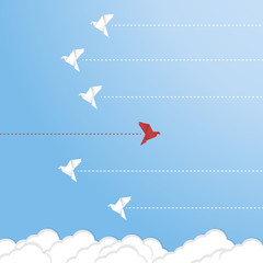Fototapeta premium Think differently concept. Be different. Red bird changing direction. New idea, change, trend, courage, creative solution, innovation and unique way concept 