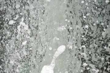 Splash of water gush of water of a fountain abstract background