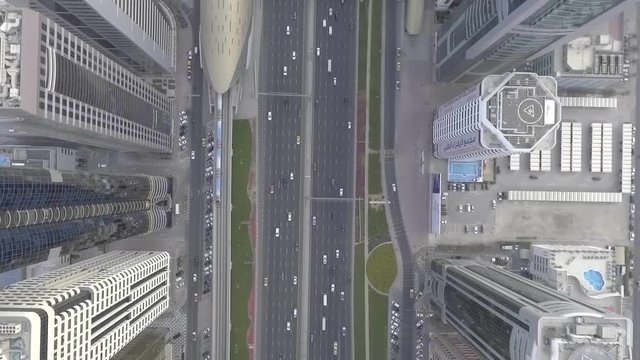 Birds eye view of major roads in Dubai with metro during rush hour traffic 