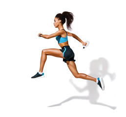 Fototapeta na wymiar Young fitness girl running with bottle of water. Photo of african american girl in fashionable sportswear on white background. Dynamic movement. Side view. Full length. Sports and healthy lifestyle