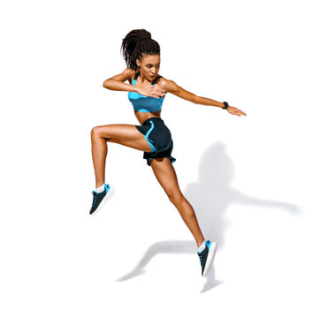 Sporty girl jumping. Photo of african american girl in fashionable sportswear on white background. Dynamic movement. Side view. Full length. Sports and healthy lifestyle