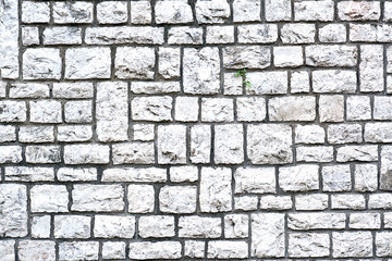 Background from a wall made of block shaped natural stones