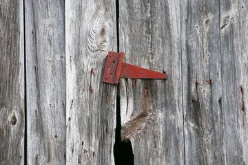 rusty hinge on old barn door