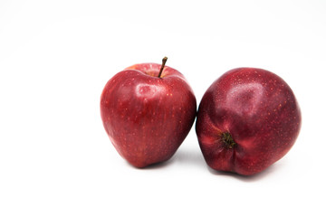 Red organic apples isolated on a white background.