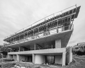 Construction site in progress , third floor under construction with scaffolding