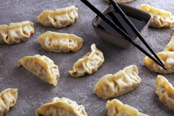 Gyoza or dumplings snack with soy sauce.
