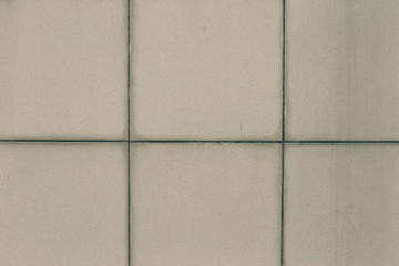 Fototapeta premium old square tile with dirty scuffs background texture