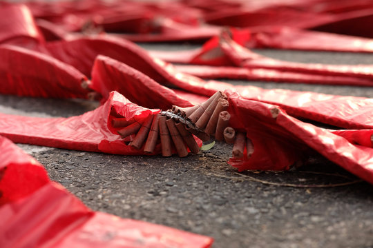 row of red firecrakers on floor