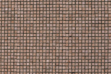 pink mosaic on the wall of an old soviet house