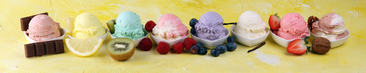 Various of ice cream flavor whit fresh blueberry, strawberry, kiwi, lemon, vanilla setup on rustic background . Summer and Sweet cold ice cream