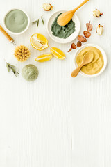 Set of homemade cosmetics ingredients with cosmetic clay. Spa treatments, aroma theme. White deck, top view