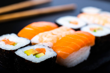 .sushi roll close-up on a slate stone background