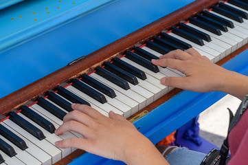 Two girls playing piano