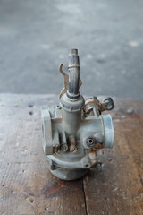 Old motorcycle carburetor, bring it to the mechanic for repair.
