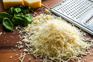 close up of delicious cheese on wooden cutting board