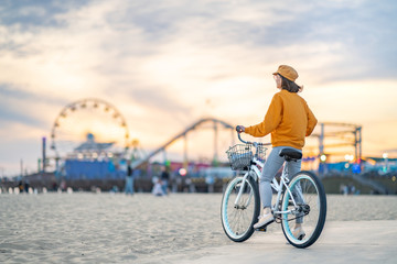 Young woman with a bike outdoors