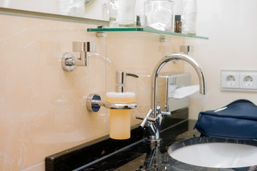 liquid soap dispenser in bathroom