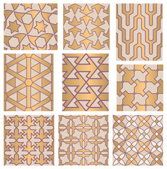 Set of decorative golden geometrical seamless patterns.