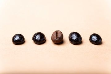 group of coffee beans on a brown background